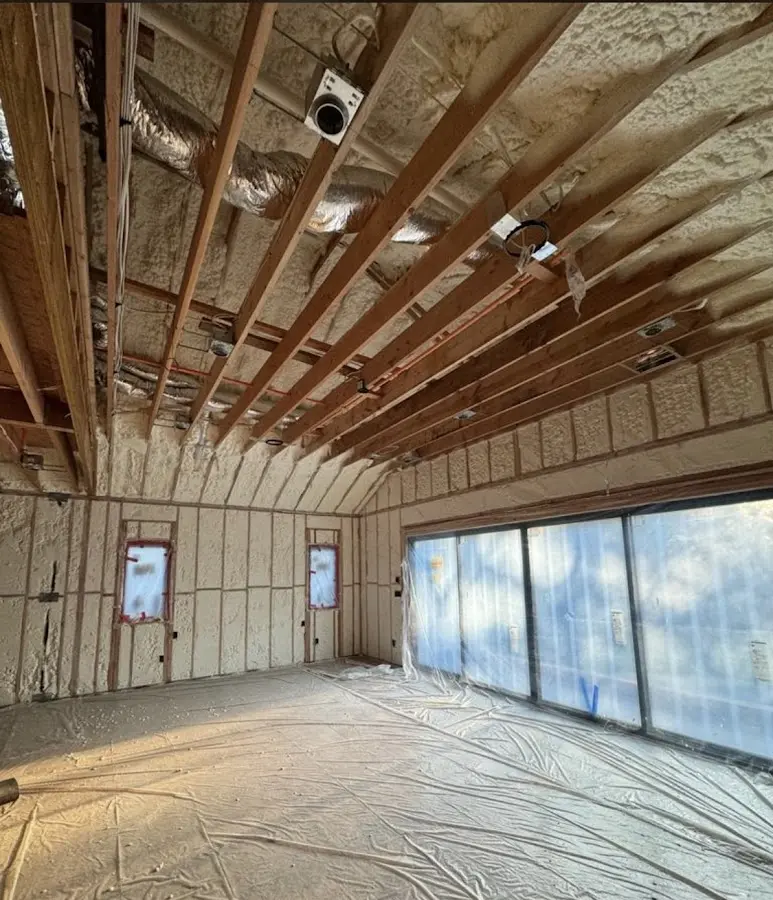 Interior walls and ceiling insulated with spray foam during new construction in Wantage